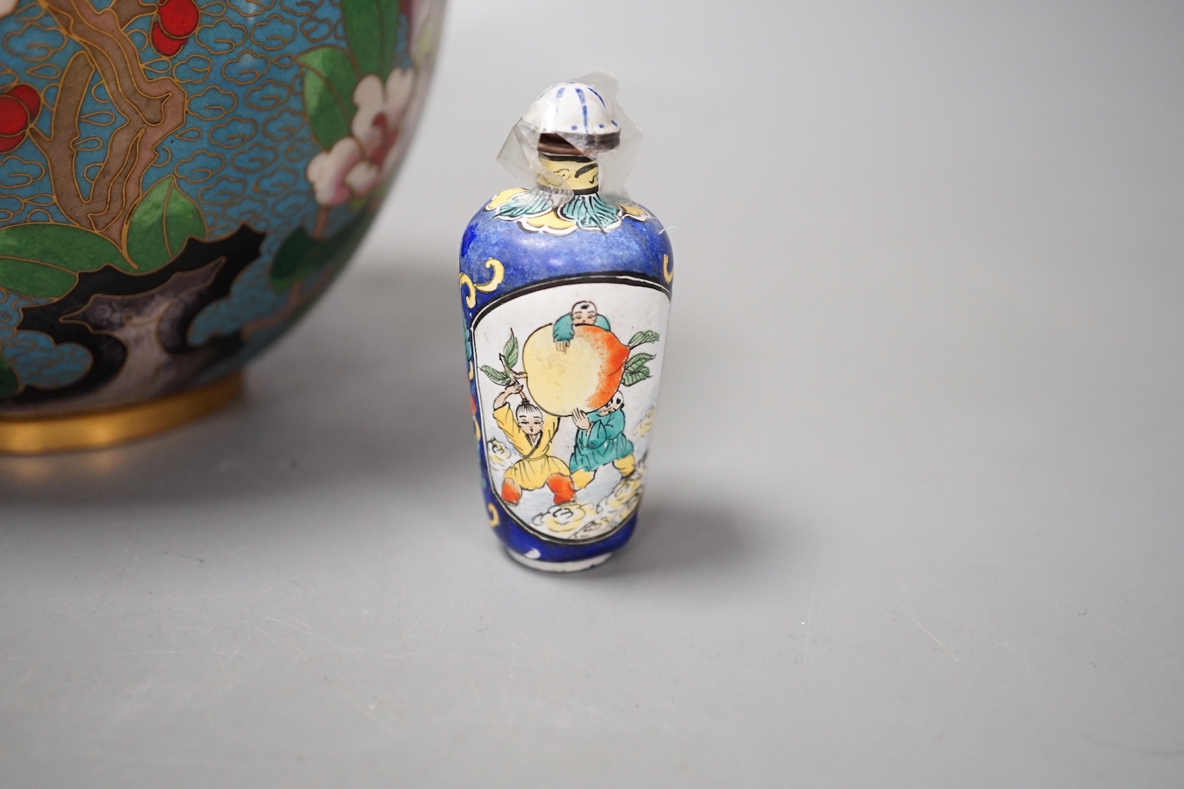 A Canton enamel tea bowl, snuff bottle, and a cloisonne enamel jar and cover